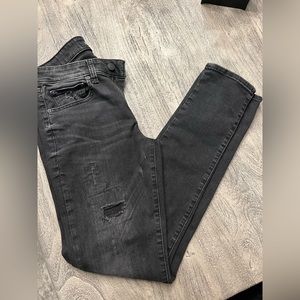 Express men’s skinny denim size 31/34. Distressed areas dark gray/black